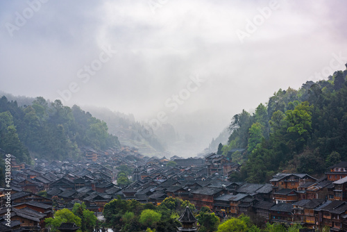 Zhaoxing Dong Village in the morning mist in spring photo