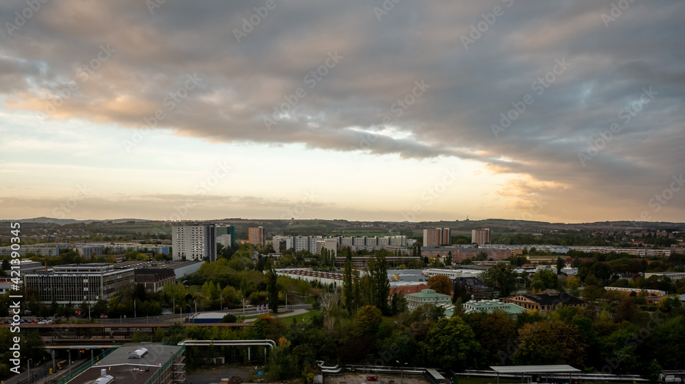 Panorama of Dresden Prohlis residential district from a high angle point of view. Cityscape at morning during sunrise with dramatic clouds.