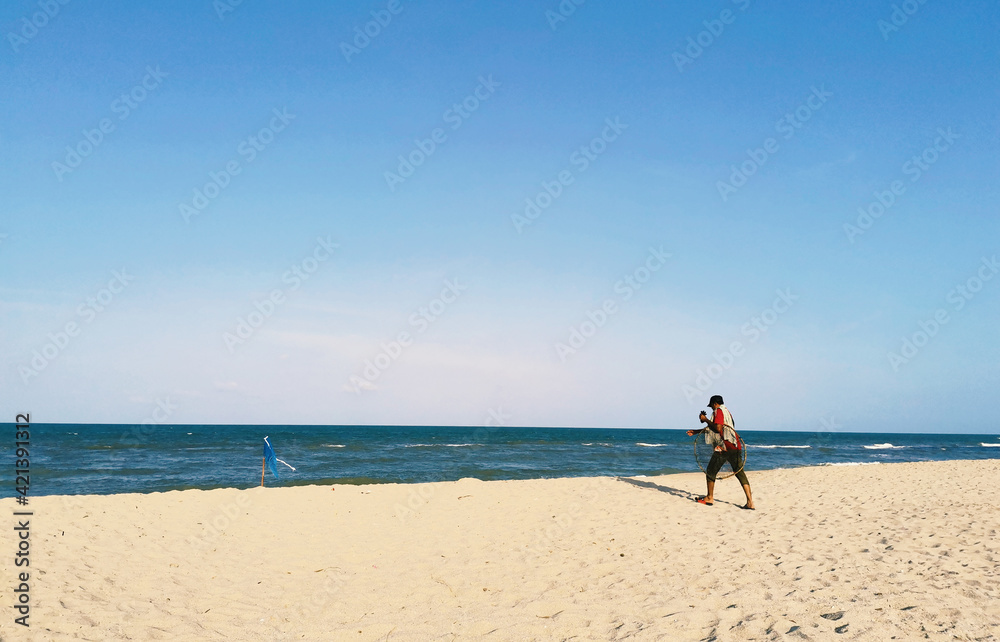 Fisherman  on the beach