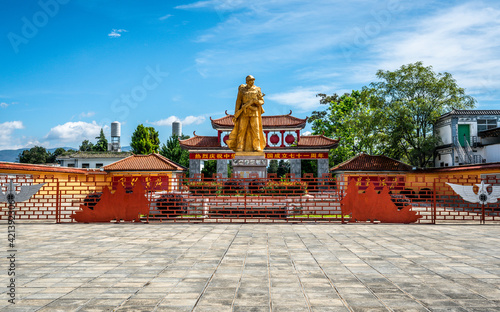 Dali ancient city monument to People's Heroes and empty square under blue sky in Yunnan China