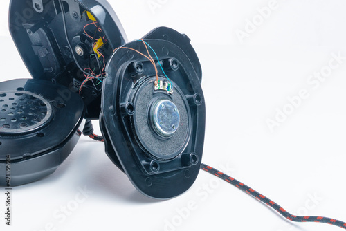 Repair of broken headphones with a microphone. Close-up.