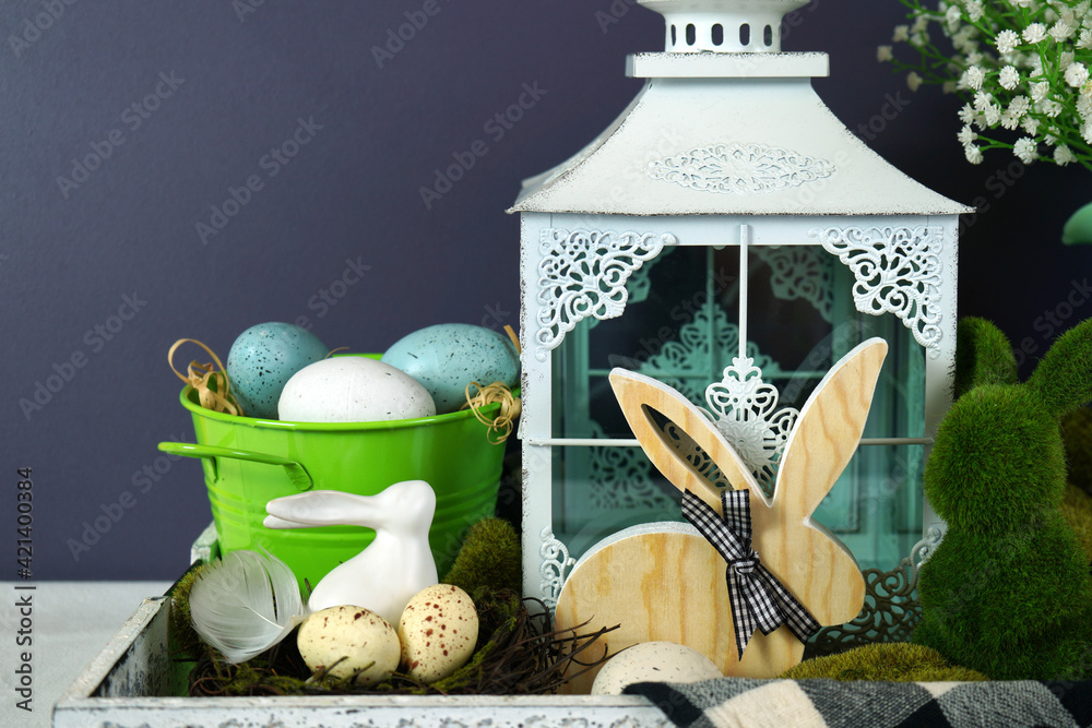 Easter farmhouse vignette with bunnies, Easter eggs and buffalo plaid check. - obrazy, fototapety, plakaty 