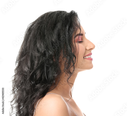 Portrait of young woman with beautiful curly hair on white background, closeup