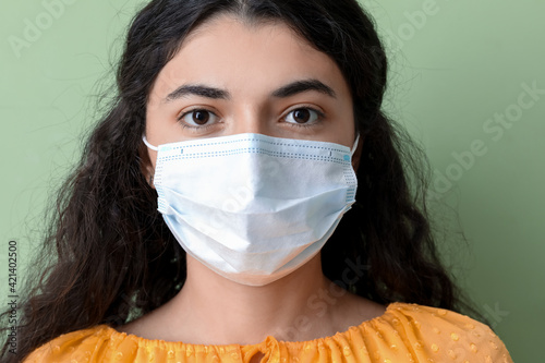 Young woman wearing medical...