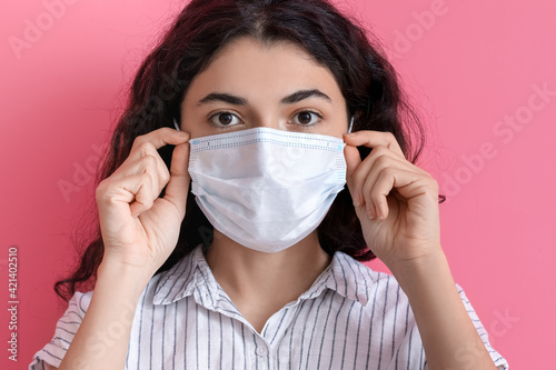 Young woman wearing medical...