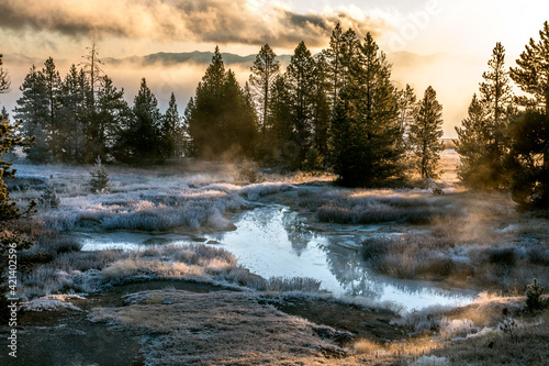 frosty and misty autumn morning in the hot springs and geothermal pools in West Thumb in Yellowstone National Park.