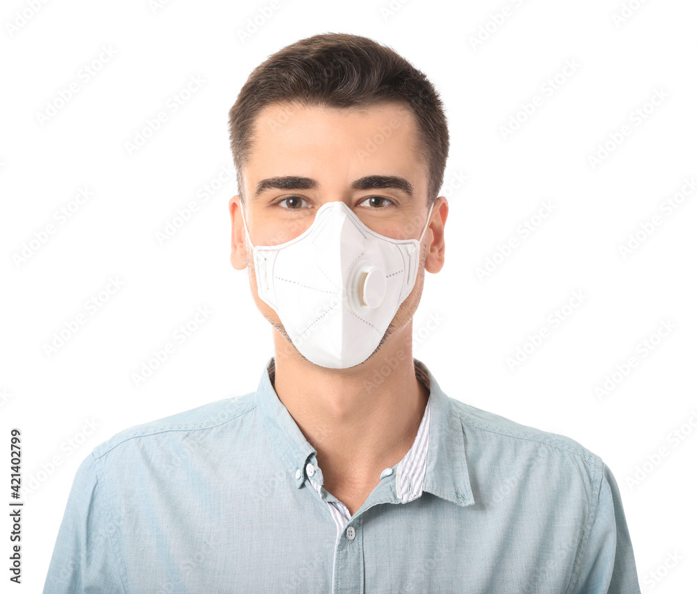 Young man wearing medical mask on white background Young man wearing medical mask on white background