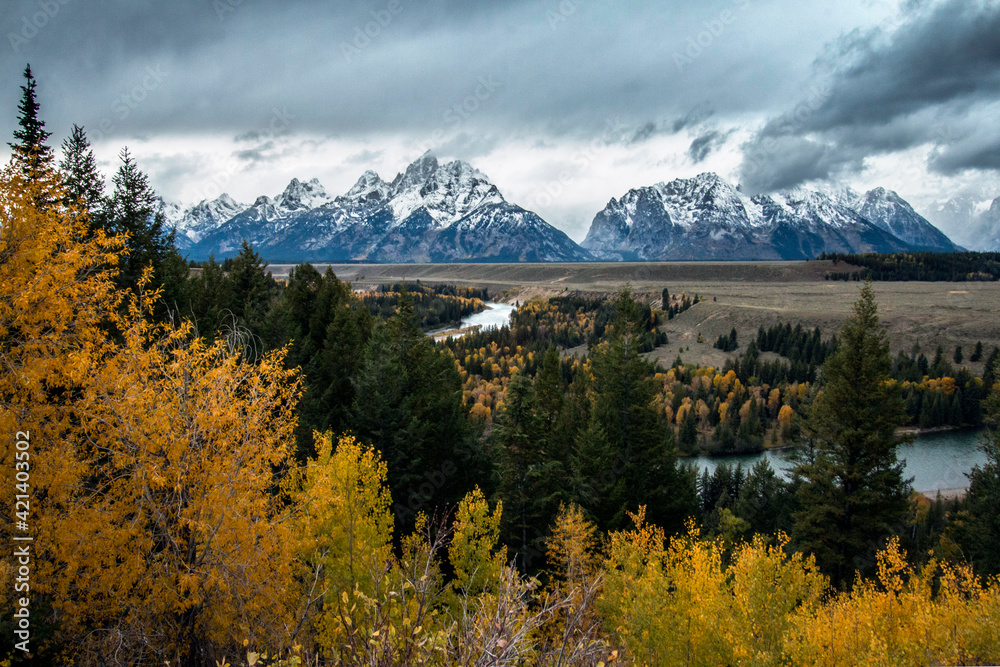 dramatic wintry weather in autumn in the Grand teton national Park. The Tetons mountain range on the background.