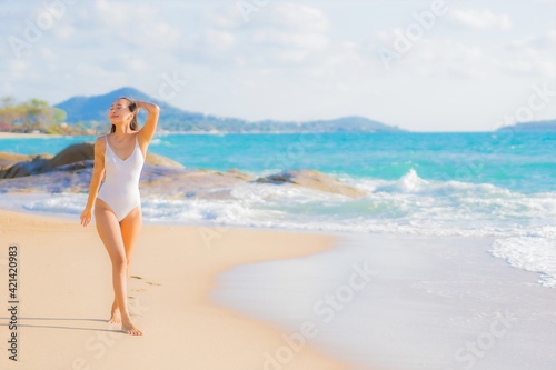 Portrait beautiful young asian woman relax smile leisure around beach sea ocean