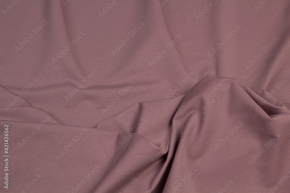Fototapeta premium Multicolored fabrics folded top view . Multi-colored textile