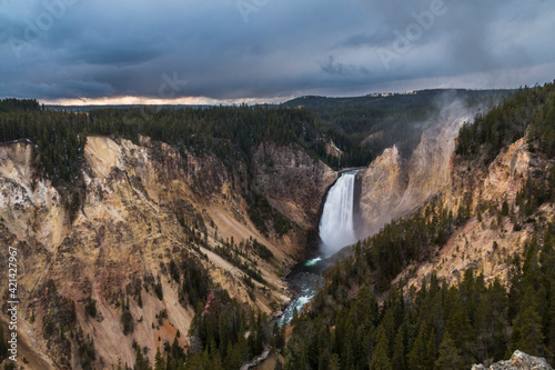 dramatic photo of the Upper Falls of the Yellowstone River in the Yellowstone NP in Wyoming.