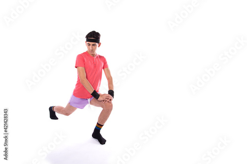 A young guy in shorts and a T-shirt goes in for sports and fitness. Retro style. 80s, 90s, 70s. Isolate. White background. © Denis