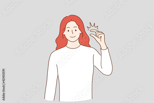 Little bit and small amount concept. Smiling red haired woman cartoon character showing little bit gesture, showing something insignificant vector illustration 