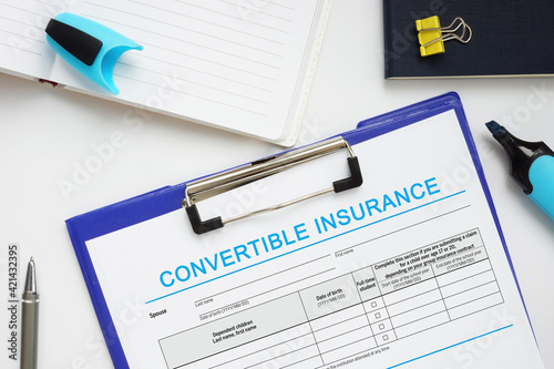 Business concept meaning CONVERTIBLE INSURANCE with inscription on the business paper photo