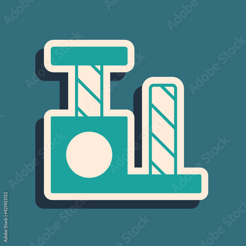 Green Cat scratching post with toy icon isolated on green background. Long shadow style. Vector