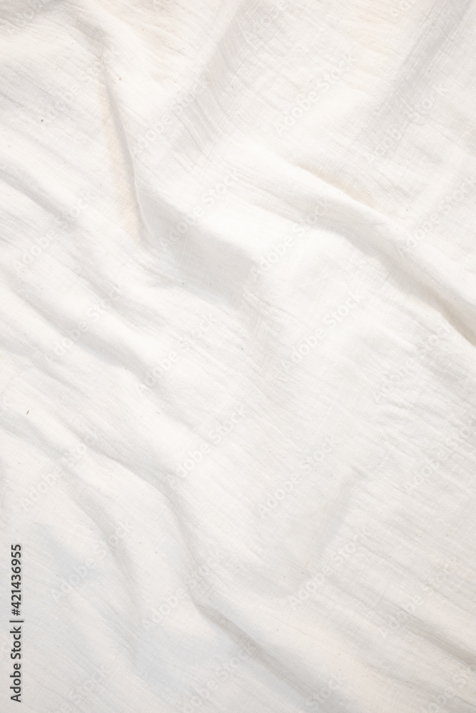 Fototapeta premium Fabric backdrop White linen canvas crumpled natural cotton fabric Natural handmade linen top view background Organic Eco textiles White Fabric texture