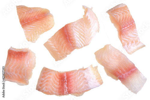 Pangasius fish fillet, pieces on a green lettuce leaf. Isolated on a white background. Fresh Fish Fillet. photo