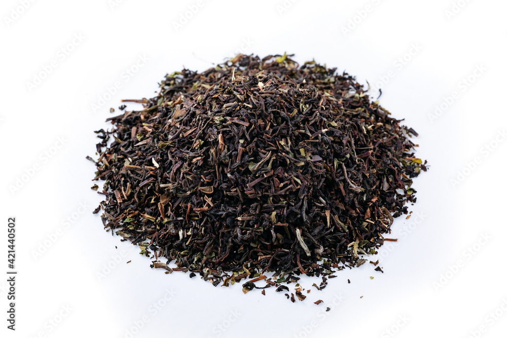 Heap of black tea on a white background. Dry black tea leaves isolated on white background, delicious, natural. Flat lay. Heap of black tea on a white background. Dry black tea leaves isolated on white background, delicious, natural. Flat lay.