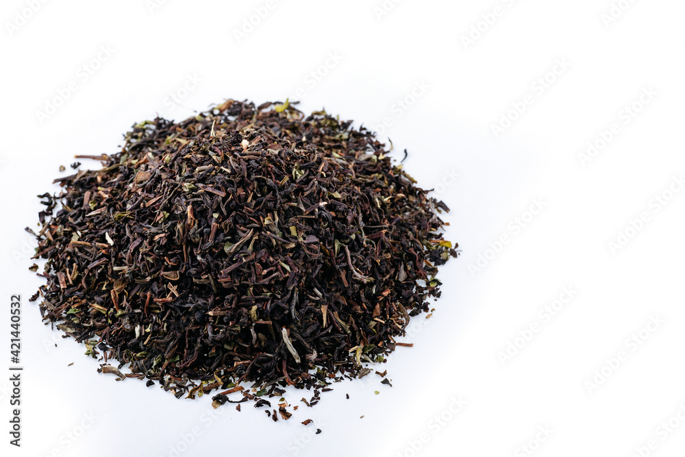 Heap of black tea on a white background. Dry black tea leaves isolated on white background, delicious, natural. Flat lay. Heap of black tea on a white background. Dry black tea leaves isolated on white background, delicious, natural. Flat lay.