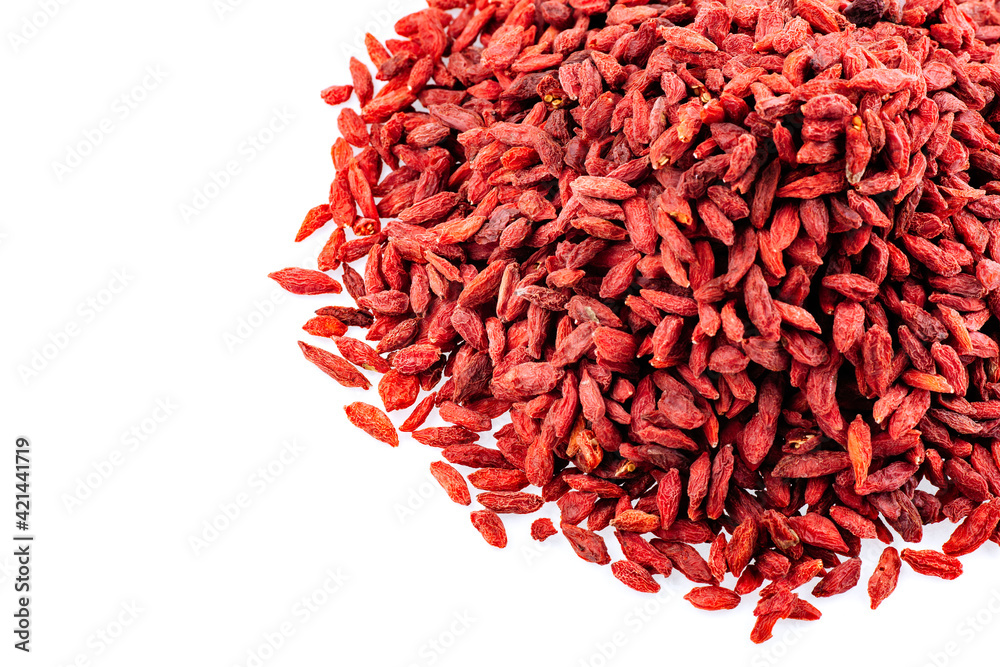 Fototapeta premium Heap of Goji berries on a white background. Pile of goji berries isolated on a white background.