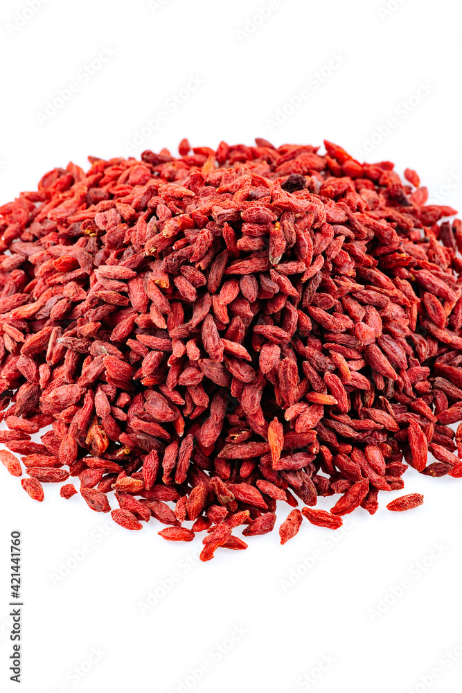 Fototapeta premium Heap of Goji berries on a white background. Pile of goji berries isolated on a white background.