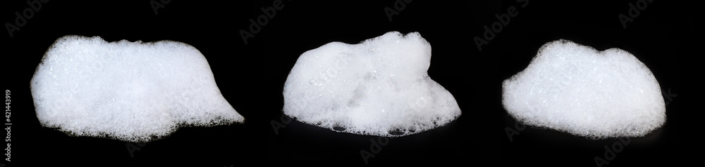 A heap of soap sud isolated on black background. Collection.