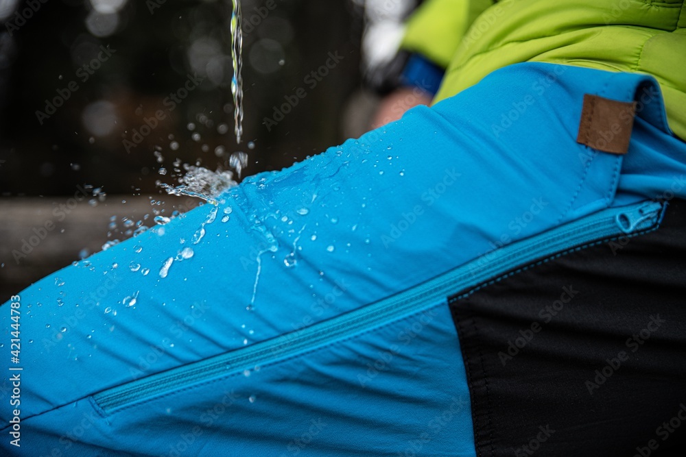 Hydrophobic effect on blue waterproof fabric. Waterproof Outdoor on the trousers.