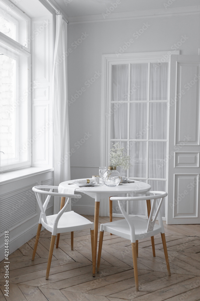 White loft interior in a Scandinavian style with a table. Set wooden table in a bright interior, photo studio. White loft interior in a Scandinavian style with a table. Set wooden table in a bright interior, photo studio.