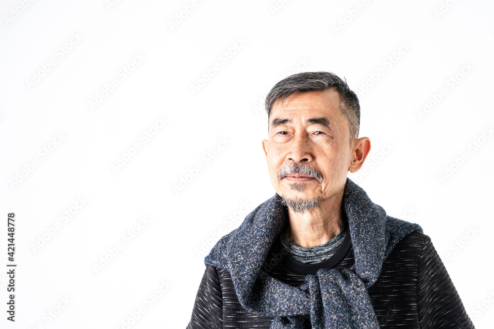 Obraz premium A smile of happy Asian elder man fashion in a gray t-shirt And a sweater on his neck. Shoot On white background in the studio. Positive active old cool senior healthy retirement concept. Copy, space