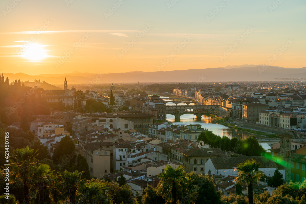Florence or Firenze sunset aerial cityscape. Panorama view from Michelangelo park square. Ponte Vecchio bridge, Palazzo Vecchio and Duomo Cathedral. Tuscany, Italy