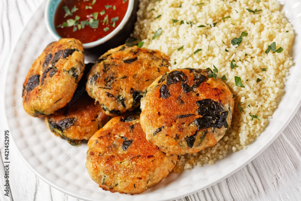 Fototapeta premium salmon and spinach fish cakes, top view
