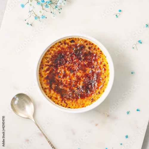 Creme brulee. Traditional French vanilla cream dessert. Burned cream, burnt creme or Trinity cream. Spanish crema catalana, rich custard base topped with layer of hardened caramelized sugar. photo