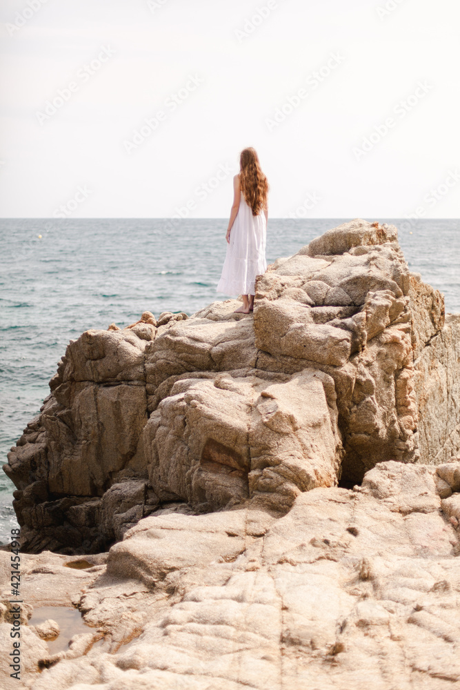 woman walking on the beach spain woman walking on the beach spain