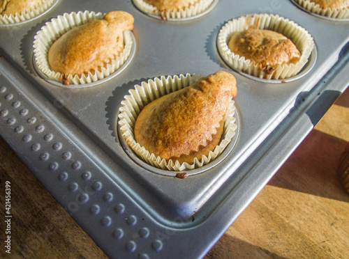 small vanilla and chocolate muffins illuminated by the morning light ready for breakfast