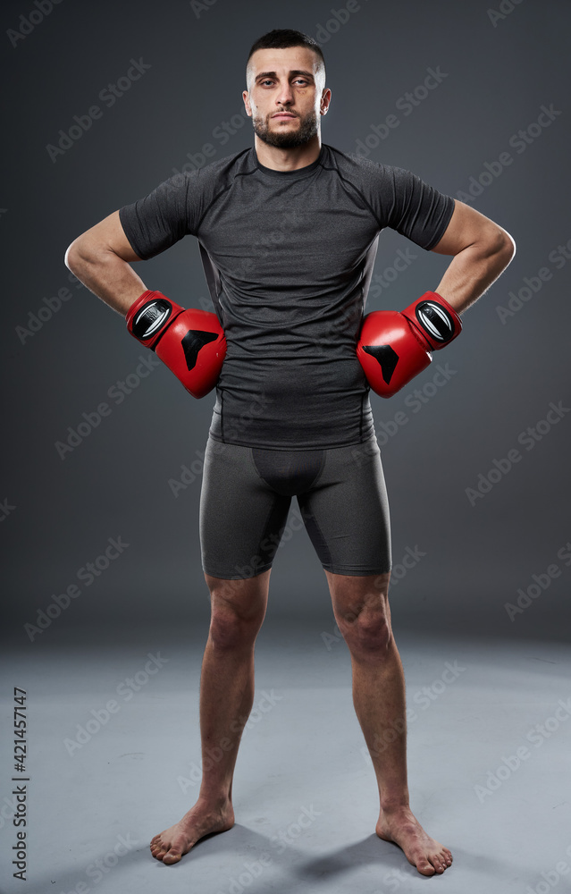 MMA fighter posing on gray