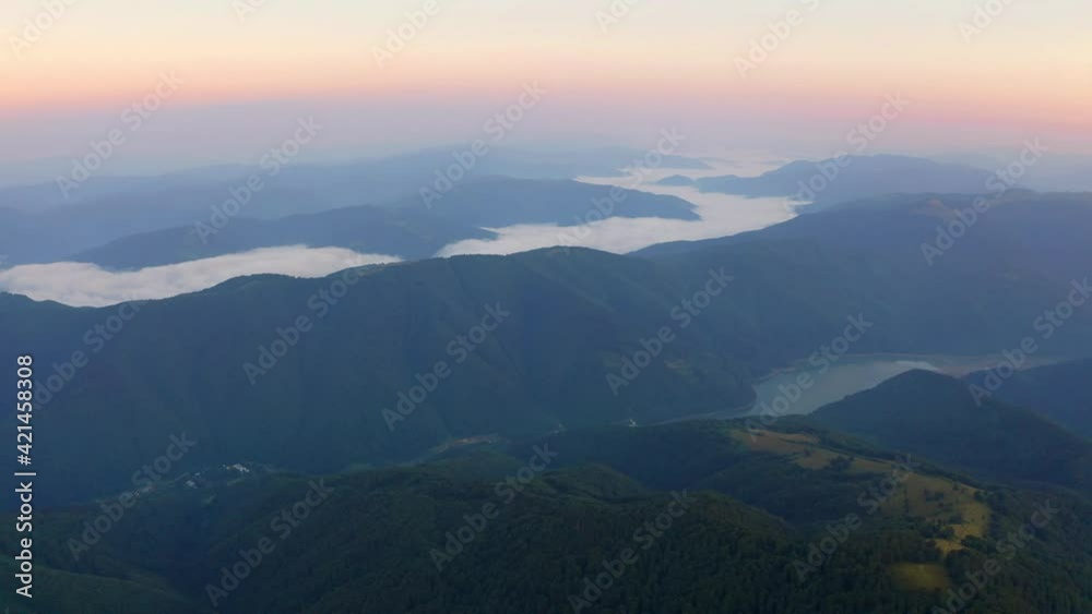 4K aerial - a bird's eye view video (Ultra High Definition) of Tereblia-Ristke Reservoir. Amazing red sky in Carpathian Mountains, Ukraine, Europe. Picturesque sunset on mountain valley. 4K aerial - a bird's eye view video (Ultra High Definition) of Tereblia-Ristke Reservoir. Amazing red sky in Carpathian Mountains, Ukraine, Europe. Picturesque sunset on mountain valley.