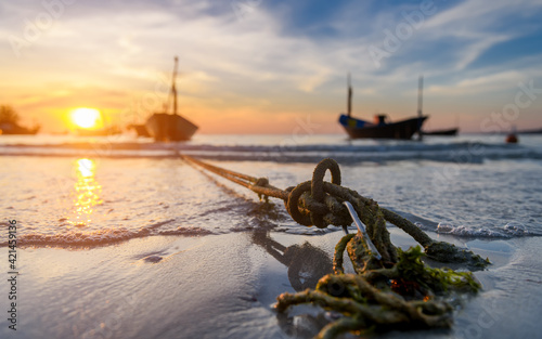 Obraz na płótnie The anchor of fishery boats in the sunset time. w salonie