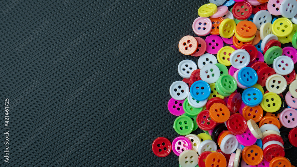 The Buttons multi colour  on black background for abstract concept