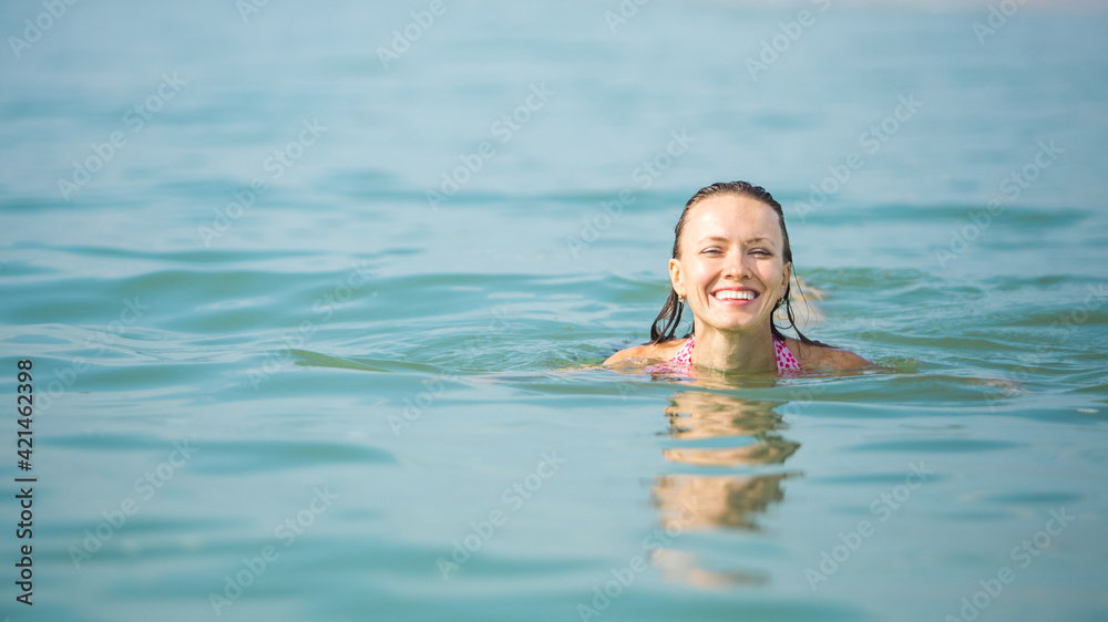  summer vacation woman , swimming in blue sea