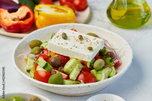 Greek village salad horiatiki with feta cheese and vegetables, vegeterian mediterranean food, low calories keto dieting meal, side view, close up