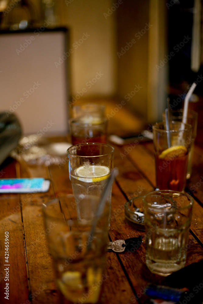 glass of lemon tea and cocktail on table glass of lemon tea and cocktail on table