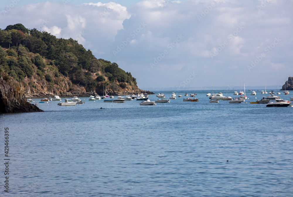  Fishing boats and yachts moored in the bay at high tide in Cancale, famous oysters production town. Brittany, France,