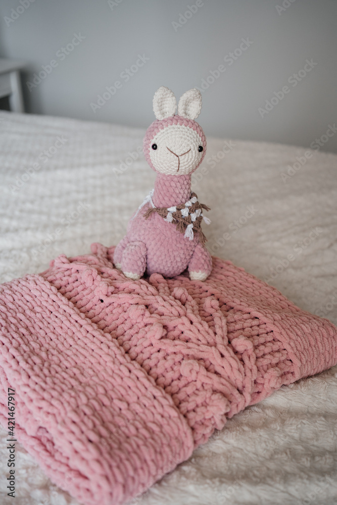 Fototapeta premium close up shot of cozy soft handmade hobby knitted toy 