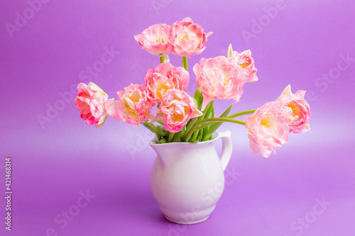 Wallpaper Mural bouquet of pink tulips in a vase on a purple background Torontodigital.ca