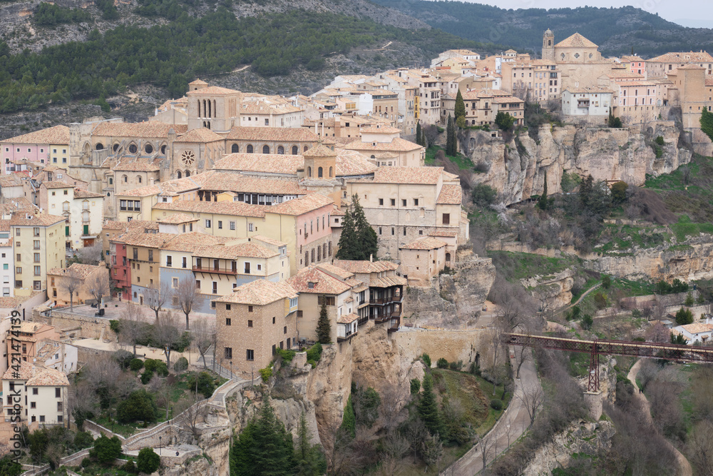 View of Hanged Houses (Casas Colgadas) and San Pablo bridge in Cuenca (Spain) taking from a hill.