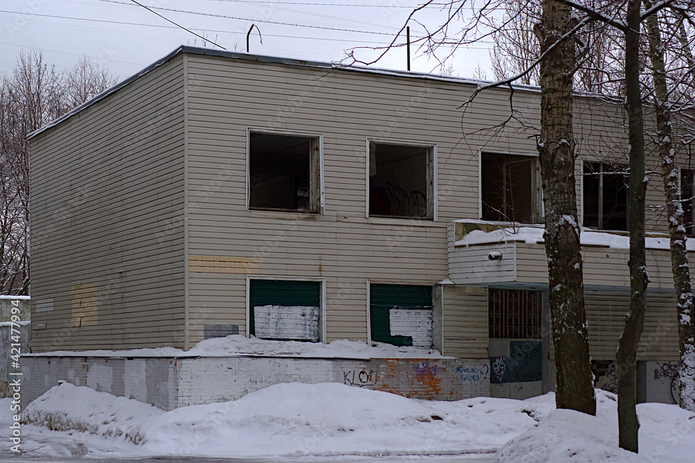 an abandoned building with broken windows an abandoned building with broken windows
