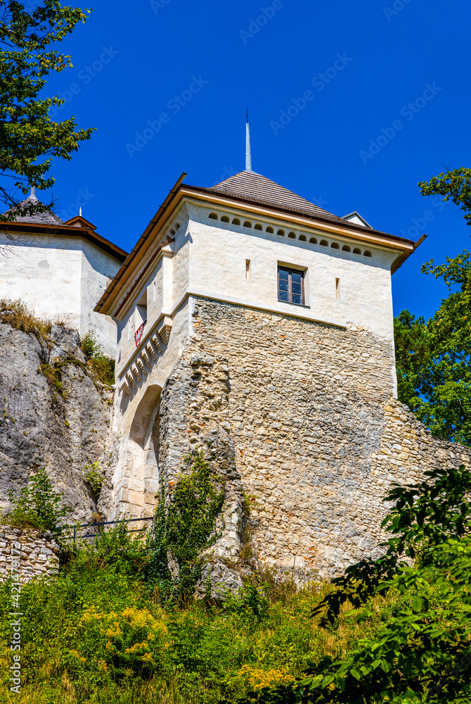Limestone rocky defense walls and towers of medieval royal Ojcow Castle on Cracow-Czestochowa upland in Lesser Poland