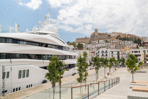 Ibiza old town and a huge yacht in the marina