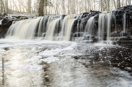 Long exposure waterfall on small river Ivande in Renda, Latvia