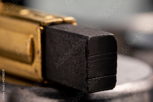 Electrically conductive graphite brush of a motor. Spare part for power tools.